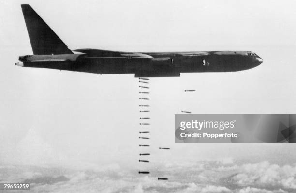 Vietnam War, 1960's, A US Air force B 52 StratoFortress plane releasing its bomb load over the Vietnam target area, having flown from it's base on...