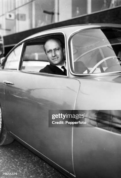 Sport, Motor Racing, Formula One, pic: April 1959, Rheims Grand Prix, Argentinian driver Juan Manuel Fangio, sits at the wheel of an Aston Martin DB4...