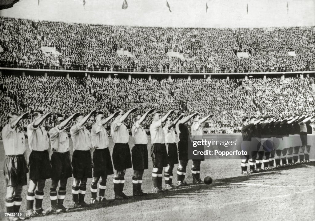 Football, Pre-World War Two, pic: 14th May 1938, Berlin, Prior to their international match with Germany in the Olympic Stadium, the England team left, give the Nazi salute alongside the Germans, as the German National Anthem is played, England beat Germa