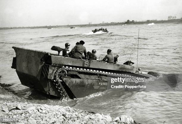 War and Conflict, World War Two, pic: November 1944, Invasion of Germany, An Allied "Buffalo" craft drives into the River Rhine with supplies for...