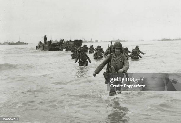 War and Conflict, World War Two, , Invasion of France, pic: June 1944, American troop reinforcements wade ashore from landing craft on to the...