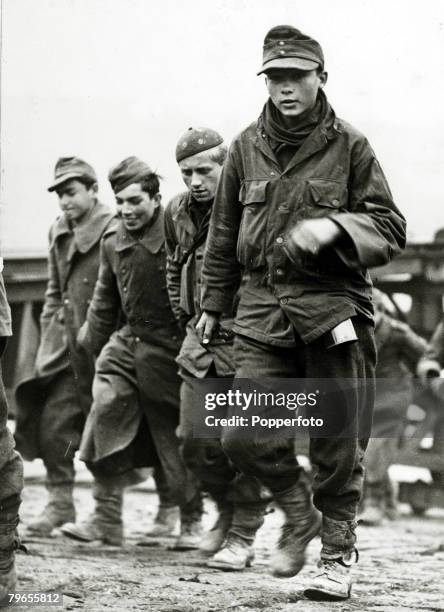 War and Conflict, World War Two, pic: October 1944, England, German prisoners of war, looking only boys, seem glad to be out of the war, as they...