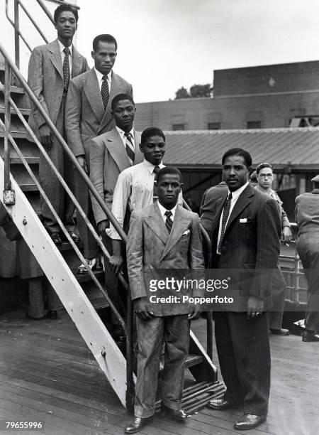 Five young boxers and their manager among the first immigrants from the Caribbean island of Jamaica to arrive at Tilbury, Essex, on board the Empire...