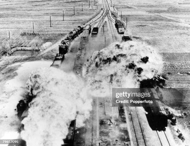 War and Conflict, The Korean War, pic: circa 1950, A train is attacked in North Korea by American B26 light bombers using napalm bombs, which causes...