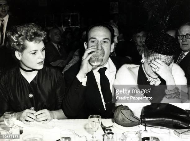 American actress Gloria Swanson is unable to hide her disappointment at losing out to Judy Holliday in the 23rd Annual Academy Awards for Best...