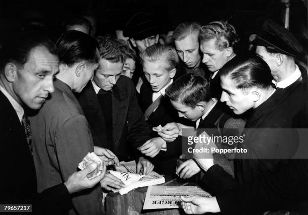 World War II, War Crimes Trials, pic: 2nd October 1946, Young Germans clamour for newspapers in Nuremberg as the local press announce the sentences...