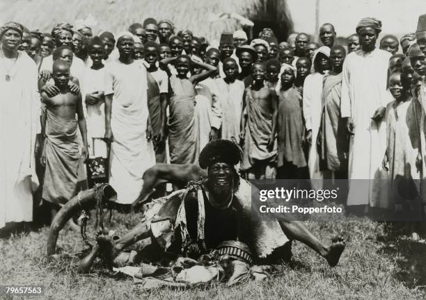 People, Africa, Uganda, pic: circa 1920, A witch doctor "making rain" in a tribal village