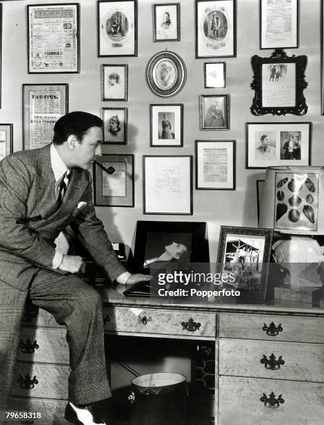 Cinema Personalities, pic: circa 1930, Jhn Barrymore pictured with some of his souvenirs, American actor John Barrymore, a major star of films in the...