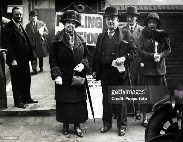 Political Personalities, pic: 19th March 1931, Stanley Baldwin , Statesman, 1867-1947, is pictured with Mrs, Baldwin as they leave a polling station...
