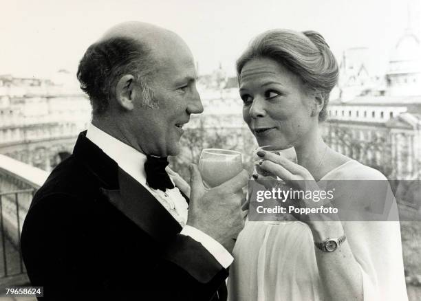 Sport, Motor Racing, pic: 17th April 1980, Fifty year old former racing driver Stirling Moss pictured with his 27 year old bride Susie after their...
