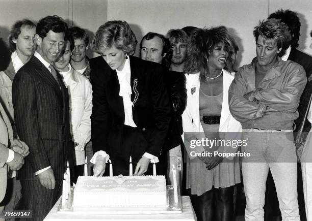 20th June 1986, The Prince and Princess of Wales cut a cake to celebrate the 10th anniversary of the Prince's Trust at a Wembley charity concert...