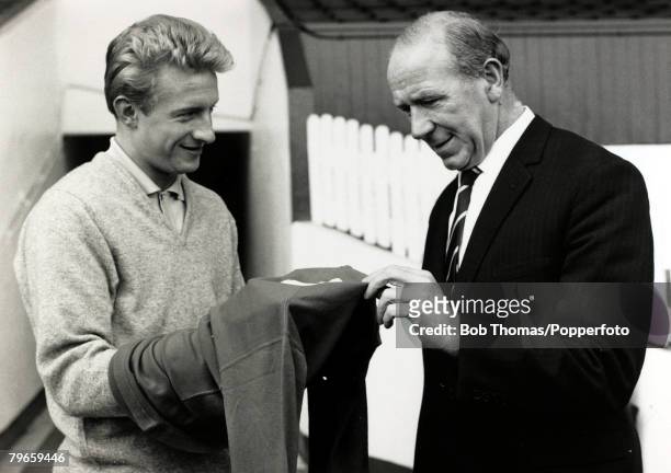 Circa 1963, Manchester United Manager Matt Busby and his Manchester United striker Denis Law