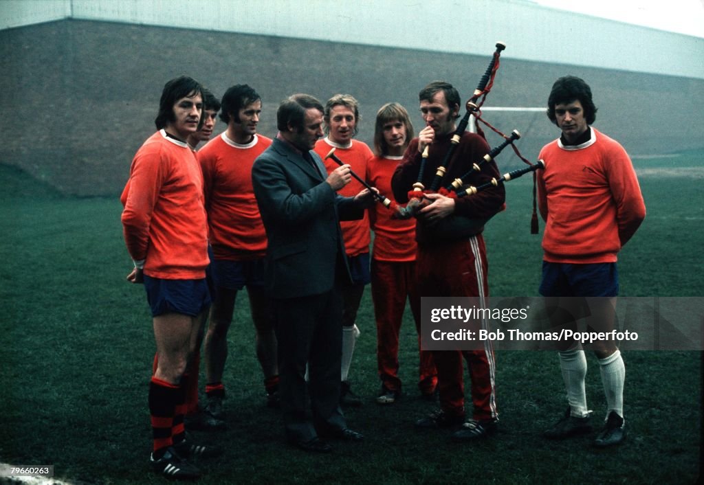 Sport/Football, February 1973, Manchester United's Scottish Manager Tommy Docherty, (front, left) with his Scottish players, L-R: Alex Forsyth, Martin Buchan, George Graham, Denis Law, John Fitzpatrick, Willie Morgan and bagpipe playing Pat Crerand