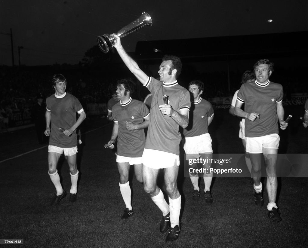Sport, Football, Elland Road, England, 4th June 1971, Inter-City Fairs Cup Final, Second Leg, Leeds United 1 v Juventus 1 (Leeds win on away goals), Leeds United's Paul Reaney holds the trophy aloft after his sides aggregate victory, with L-R: Allan Clark