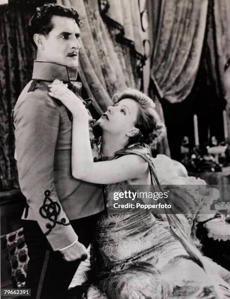 Film actors Greta Garbo and John Gilbert in a scene from the film "Flesh and the Devil"