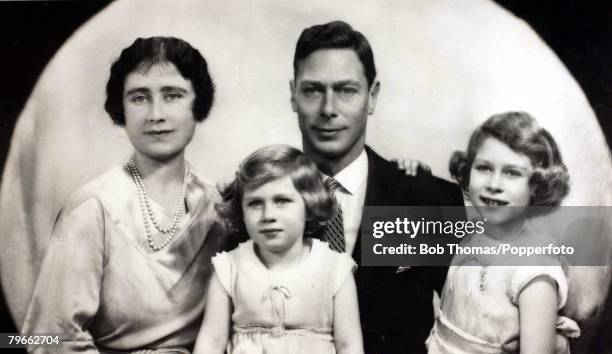 Circa 1933, Their Royal Highnesses The Duke and Duchess of York with their children Princess Elizabeth and Princess Margaret.