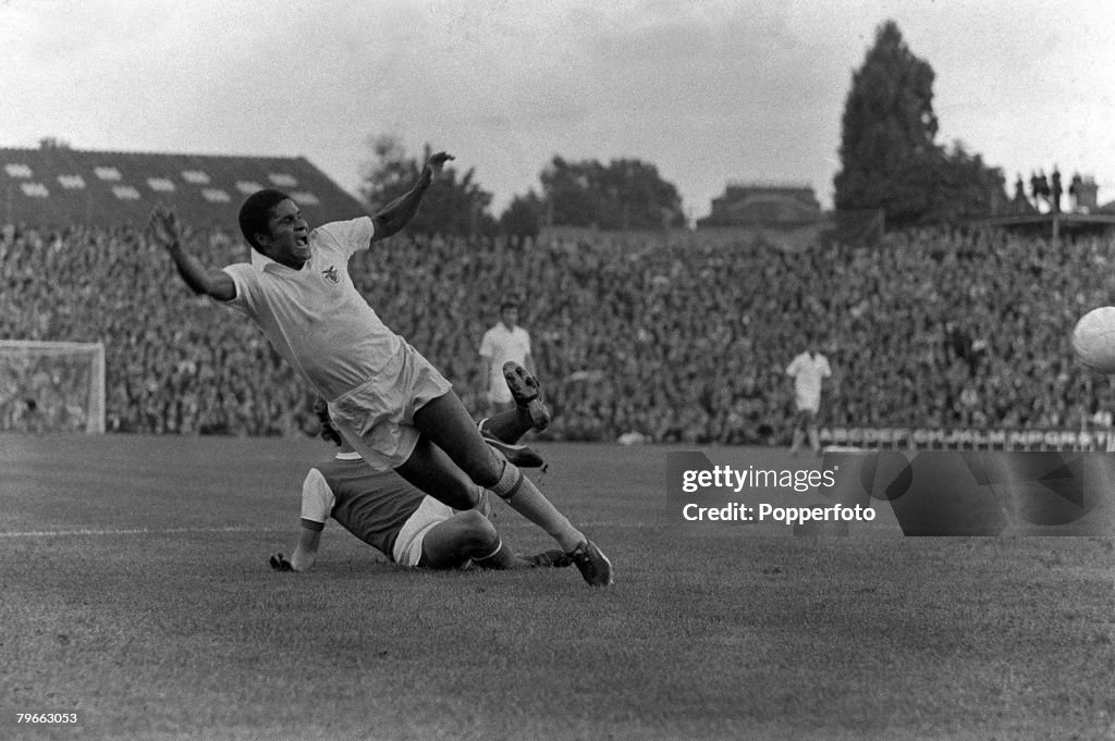 Sport, Football, London, England, 4th August 1971, Arsenal v Benfica, Eusebio of Benfica is brought down by Arsenal's Sammy Nelson during the two team's friendly match at Highbury