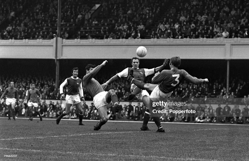 Sport, Football, London, England, 25th October 1969, League Division One, Arsenal 1 v Ipswich Town 1, Arsenal's John Radford (centre) is tackled by Ipswich's Tom Carroll (left) and Colin Harper