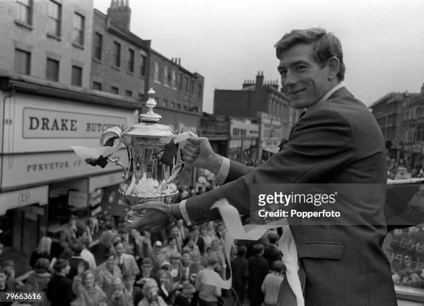Sport, Football, London, England, 21st May 1967, Tottenham Hotspur goalkeeper Pat Jennings displays the FA Cup trophy to jubilant fans from an open...