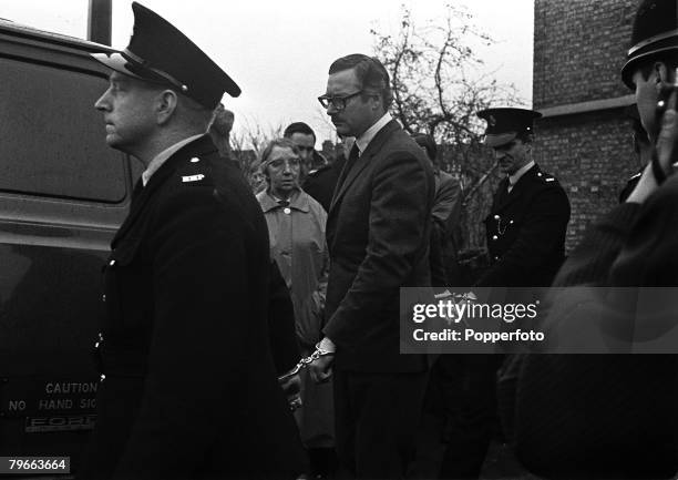 Bedford, England, 26th November 1968, Great Train Robber Bruce Reynolds is escorted by Police outside Unslade Court after being remanded in custody...