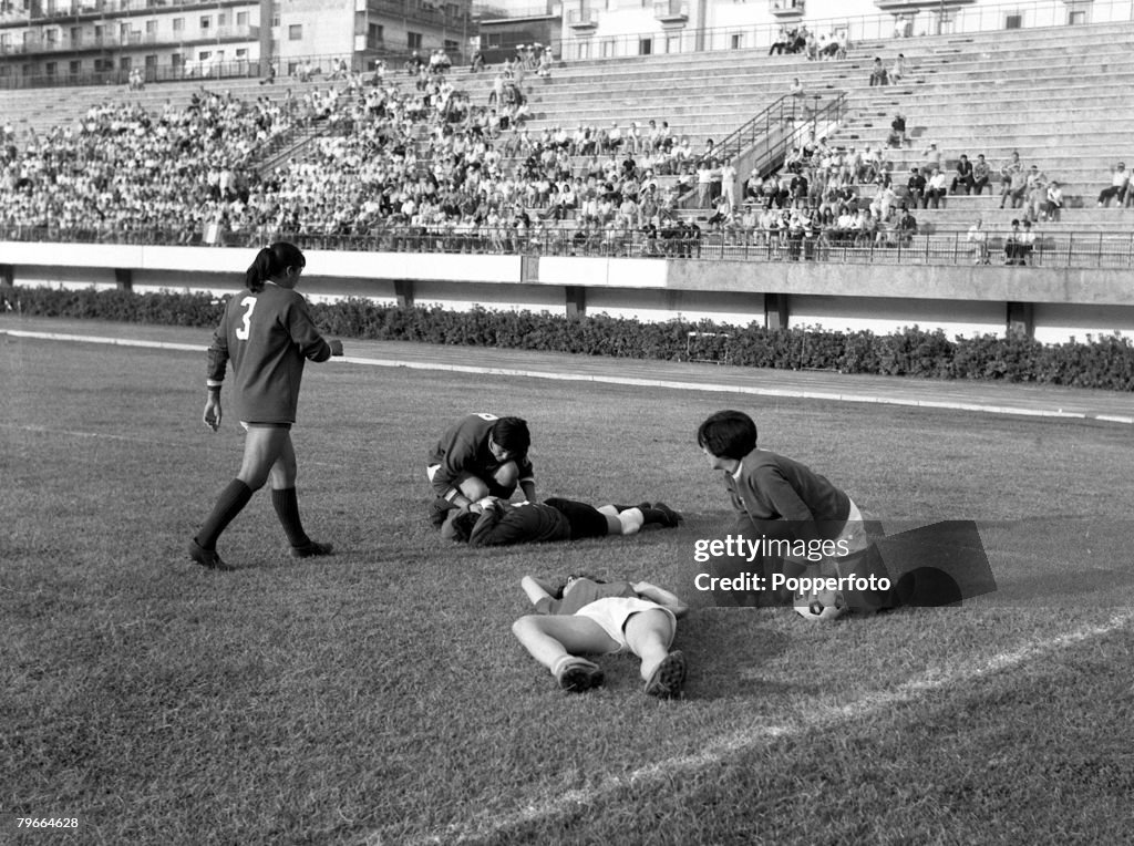 Football, Women's World Cup Semi Final, Naples, Italy, 11th July 1970, Mexico's goalkeeper holds her head after a collision with an Italian player (foreground) during their semi-final match, won by Italy 2-1