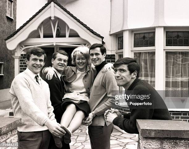 30th March 1966, Christine McCann gets a lift from Chelsea footballers John Hollins, Eddie McCreadie and George Graham, On the far right Christine+s...