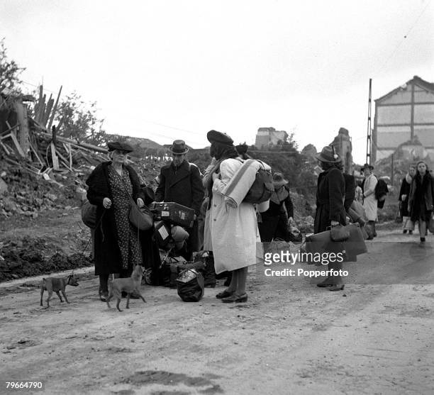 World War Two, 15th October 1944, Aachen, Germany, German civilians with their pets and belongings move away from the ruins of the German town of...