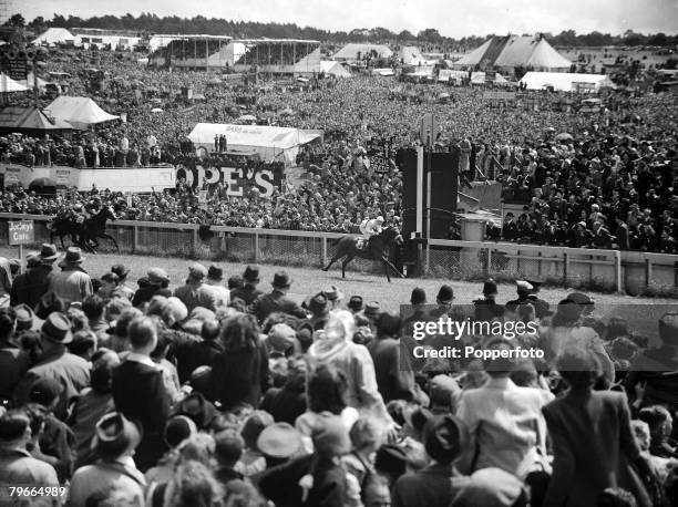Horse Racing, Surrey, England, 7th June French outsider "Pearl Diver" ridden by G, Bridgland crosses the line to win the Epsom Derby watched by a...