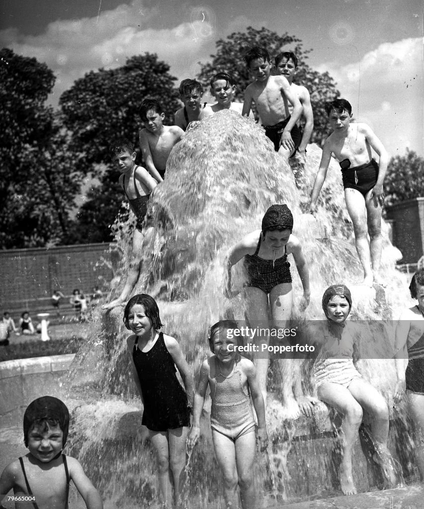 London, England,14th May 1947, Children delight in the cooling waters of a fountain in Brockwell Park, London, where the Lido is the most popular place for them during the warm spell, of sunny weather