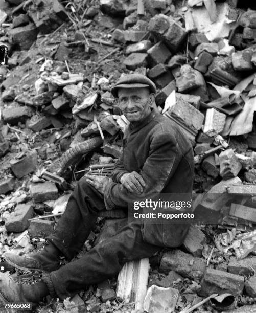 World War II, 18th October 1944, Aachen, Germany, A German civilian sits dazed in the ruins of his home