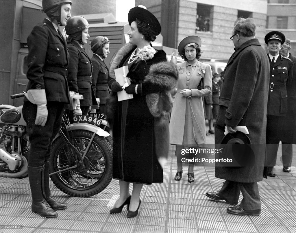 World War II, 6th December 1944, Queen Elizabeth, later the Queen Mother, accompanied by Princess Elizabeth, later Queen Elizabeth II, (centre) and Herbert Morrison (right) the minister of home security talk to women motorcyclists during their visit to th