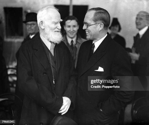 22nd April 1938, London, England, Irish dramatist George Bernard Shaw talks to United States Ambassador to Britain Joseph Kennedy after the National...