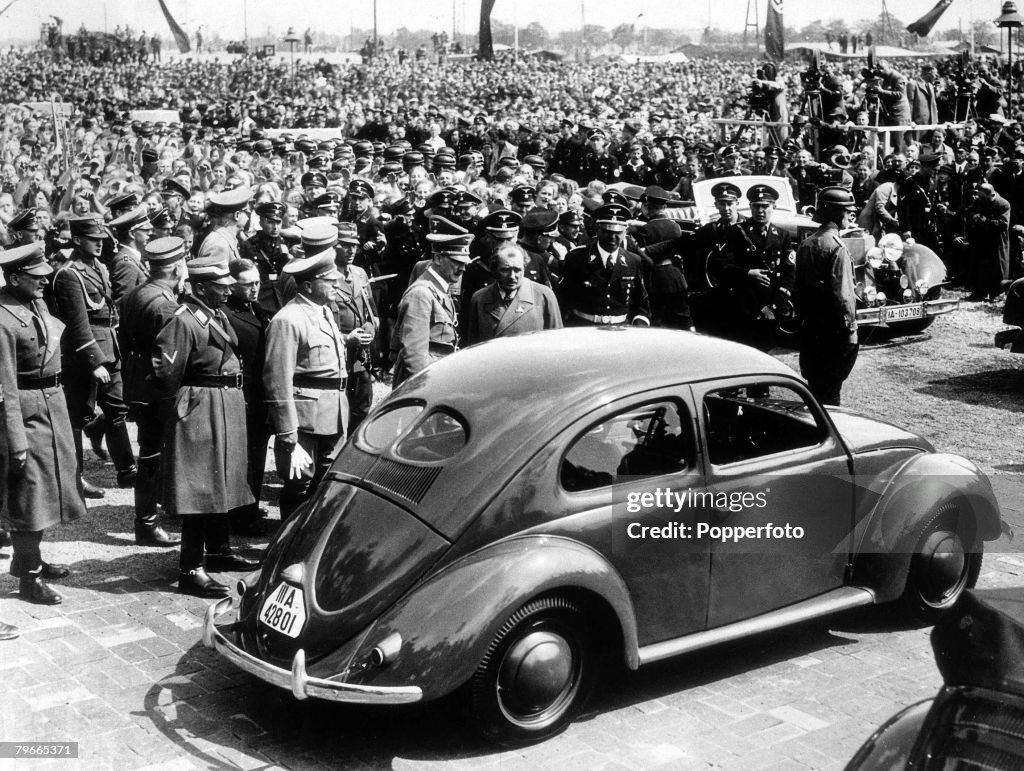 27 May 1938, German Chancellor and Nazi dictator Adolf Hitler inspects the new ,People+s car at the Fallensleben German car factory designed to manufacture six million of the cars, selling at 79 each, On Hitler+s left is the car+s designer Dr Ferdinand Po