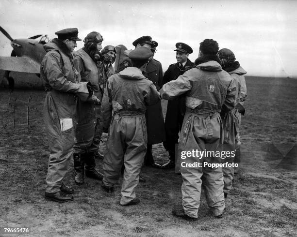 World War II England, A picture of the pilots of Eagle Squadron lined up beside one of their aeroplanes, The squadron made up of American Fighter...