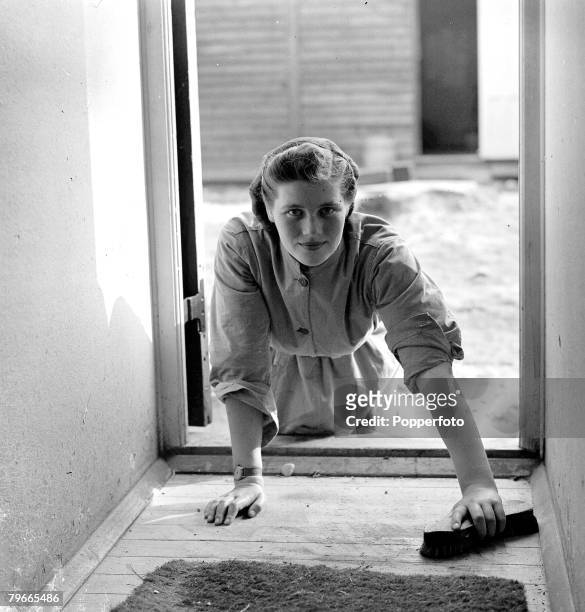 World War II, 28th September 1941, Mary Churchill, 18 year old daughter of British Prime Minister Winston, is pictured scrubbing the Barrack room...