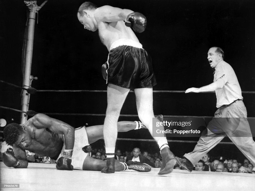 Boxing, 27 June 1959: Sweden+s Ingemar Johansson stands over the World Heavyweight Champion, American Floyd Patterson, American Referee Ruby Goldstein steps in to stop their New York Fight in the 3rd round, Patterson was knocked down 7 times in their figh