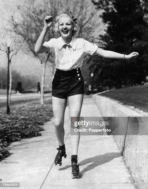California, USA, 7th May 1936, Film star Betty Grable pictured keeping fit in Hollywood by a pre breakfast roller skate spin