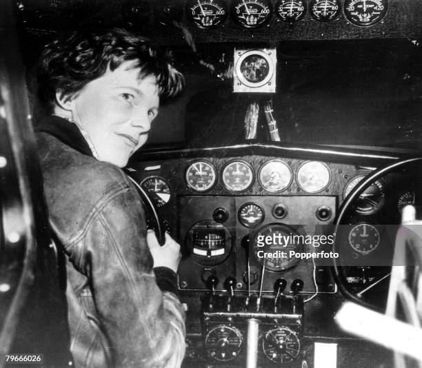 August 1937, American aviator and pilot Amelia Earhart is pictured at the controls of her aeroplane