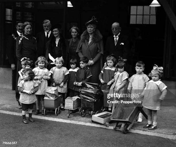 22nd October 1937, Deptford, London, England, Queen Mary with young children and officials at the opening of the Rachel Macmillan Training College