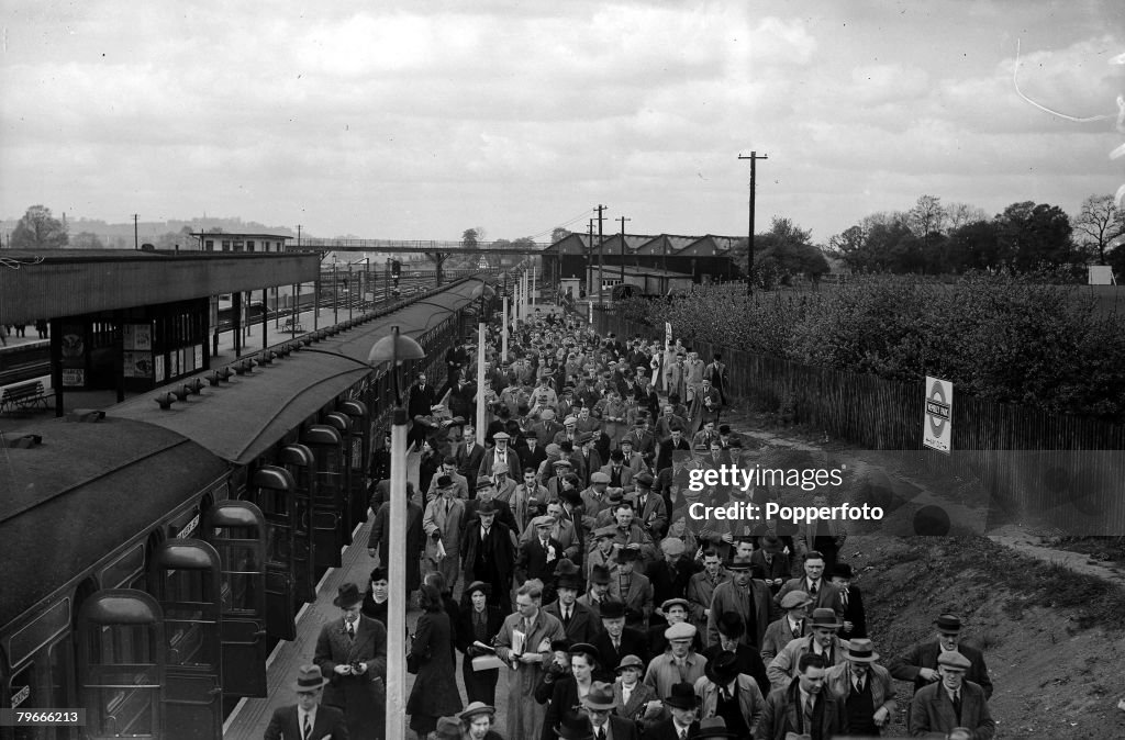 Football, 30th April 1938, Wembley, London, FA Cup Final, Preston North End v Huddersfield Town, Cup Final crowds flock to the stadium as they leave the trains at the station