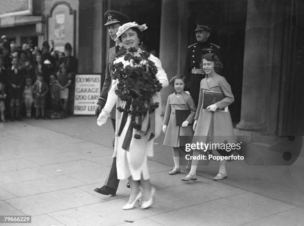 27th May 1937, London, England, King George VI and Queen Elizabeth followed by L-R: Princesses Margaret and Elizabeth, leave London+s Olympia after...