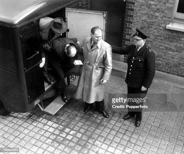 8th April 1953, Fohn Reginald Halliday Christie aged 55 arrives with head bowed at West London Magistrates court where he was accused of his wife...