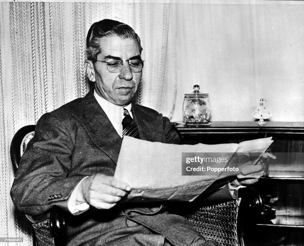 1955, Naples, Italy, American gangster Charles ,Lucky Luciano reads a