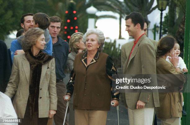 Queen Sophia, the Infanta Maria-Pilar, the Infante Felipe, and behind, Luis Gomez Acebo.