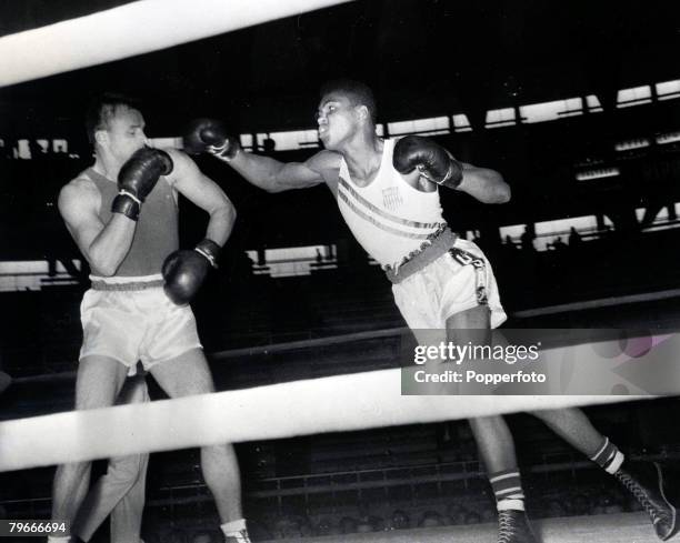 Olympic Games, Rome, Italy, Boxing, Cassius Clay of the USA punches Gennadiy Shatov of the Soviet Union whom he beat on a unanimous points victory to...