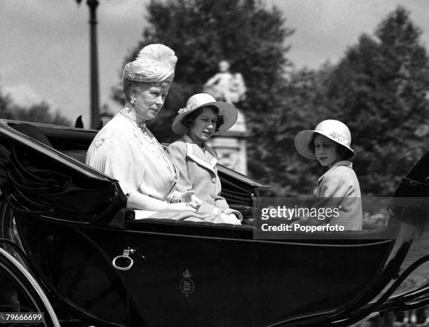 London, England, 9th June Queen Mary with her granddaughters Princess Elizabeth and Princess Margaret driving in horse drawn carriage to attend the...