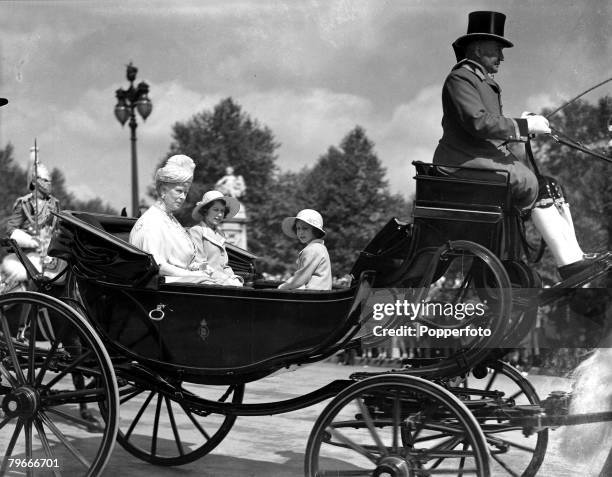 London, England, 9th June Queen Mary with her granddaughters Princess Elizabeth and Princess Margaret driving in horse drawn carriage to attend the...