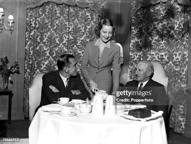Tennis, 4th January 1936, Great Britain's Fred Perry the Tennis sensation with his wife film star Helen Vinson and his father having tea at a central...