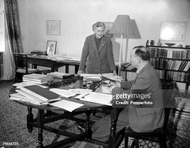January 1946, British Crime Author Agatha Christie talks with her husband Max Mallowan in his study at their Devonshire home, Greenway House