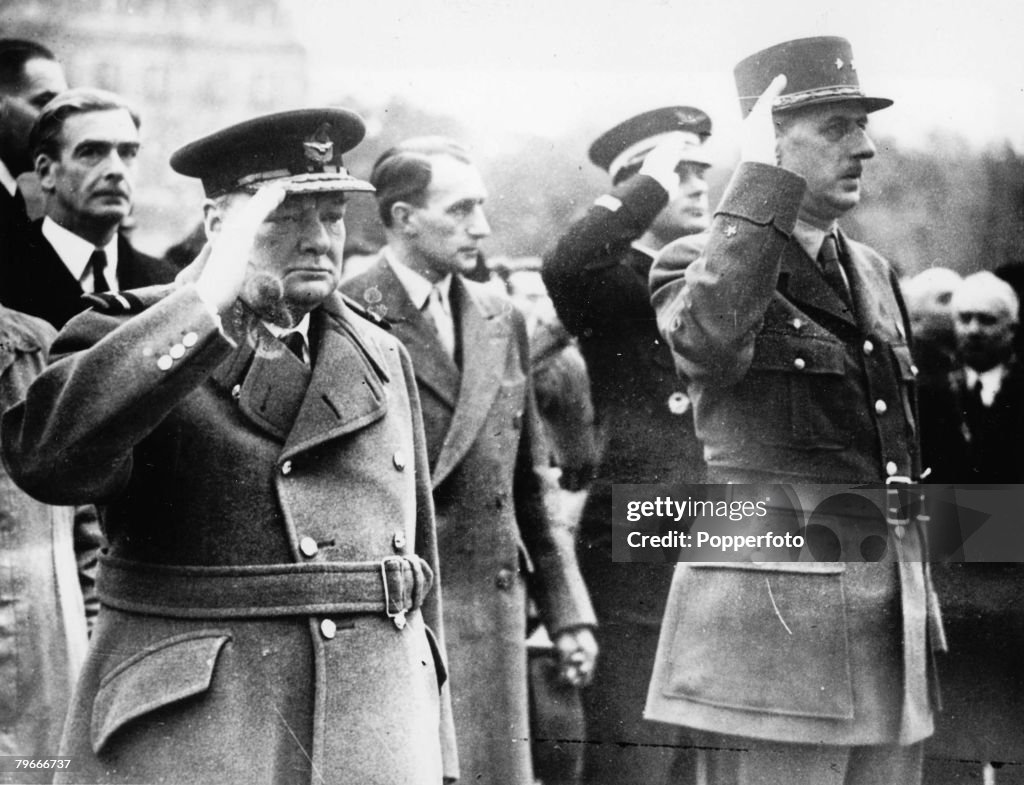 Paris, France, 13th November, 1944, British Prime Minister Winston Churchill and General Charles De Gaulle salute the tomb of France's Unknown Soldier during the Armistice Day celebrations in Paris during World War Two